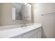 Bright bathroom features a white vanity with a large mirror and chrome fixtures at 400 Tharps Ln, Raleigh, NC 27614