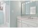 Charming bathroom with modern vanity, bright mirror, and bath with shower at 400 Tharps Ln, Raleigh, NC 27614
