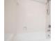 Enclosed white bathtub with white shower curtain rod and shower head at 400 Tharps Ln, Raleigh, NC 27614