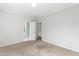 Bedroom boasts neutral carpet and an open doorway to bathroom at 400 Tharps Ln, Raleigh, NC 27614