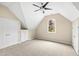 Spacious bedroom with ceiling fan, carpet, large window and closet at 400 Tharps Ln, Raleigh, NC 27614