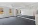 Bright bedroom with ceiling fans, carpet, and a mirrored wall at 400 Tharps Ln, Raleigh, NC 27614