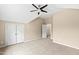 Bedroom offers neutral carpet, ceiling fan, closet, and an adjoining room at 400 Tharps Ln, Raleigh, NC 27614