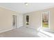 Cozy bedroom features neutral carpet, natural light and an ensuite bathroom at 400 Tharps Ln, Raleigh, NC 27614