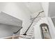 Grand foyer featuring a chandelier, staircase, and hardwood floors offering a sophisticated welcome at 400 Tharps Ln, Raleigh, NC 27614