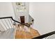 Grand foyer featuring a chandelier, staircase, hardwood floors, and front door at 400 Tharps Ln, Raleigh, NC 27614