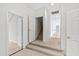 Bright hallway with access to the staircase, neutral carpet and white paint at 400 Tharps Ln, Raleigh, NC 27614
