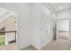 Bright hallway features large closets and doorway to staircase at 400 Tharps Ln, Raleigh, NC 27614