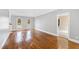 Elegant living room featuring hardwood floors, recessed lighting, and arched windows at 400 Tharps Ln, Raleigh, NC 27614