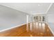 Spacious living room with hardwood floors and sliding glass doors to the deck at 400 Tharps Ln, Raleigh, NC 27614