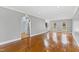 Spacious living room featuring hardwood floors, recessed lighting, and arched windows at 400 Tharps Ln, Raleigh, NC 27614