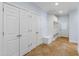Mudroom with ample closet space, built-in storage, and tiled floor at 400 Tharps Ln, Raleigh, NC 27614