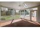 Covered back patio with stained wood floors, white railings and open views to the backyard at 400 Tharps Ln, Raleigh, NC 27614