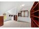 Walk-in closet with carpet and custom built-in wooden shelving at 400 Tharps Ln, Raleigh, NC 27614