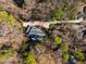Aerial view of the property surrounded by mature trees offering privacy and seclusion at 402 Westwood Dr, Chapel Hill, NC 27516
