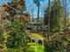 Large backyard with a pergola and home in the background at 402 Westwood Dr, Chapel Hill, NC 27516