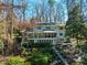 A large home with a screened porch and a backyard with lush landscaping at 402 Westwood Dr, Chapel Hill, NC 27516