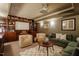 Finished basement featuring built-in bookshelves, a projector screen, comfortable seating, and modern decor at 402 Westwood Dr, Chapel Hill, NC 27516
