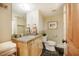 Charming bathroom featuring a granite countertop vanity, sleek fixtures, and a decorative mirror at 402 Westwood Dr, Chapel Hill, NC 27516