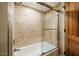 Tiled shower with a glass door at 402 Westwood Dr, Chapel Hill, NC 27516