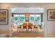 Charming dining room featuring a large window, stylish light fixture, and comfortable seating at 402 Westwood Dr, Chapel Hill, NC 27516
