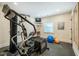 Well-equipped home gym featuring modern exercise equipment, a mounted television, and ample natural light at 402 Westwood Dr, Chapel Hill, NC 27516
