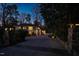 Inviting front exterior at dusk with stone gate posts and charming walkway leading to the home at 402 Westwood Dr, Chapel Hill, NC 27516