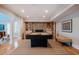 Spacious game room featuring a billiards table, hardwood floors, and a cozy atmosphere at 402 Westwood Dr, Chapel Hill, NC 27516