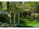 Well-manicured garden with multiple lush trellises at 402 Westwood Dr, Chapel Hill, NC 27516