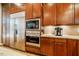 Built in stainless refrigerator with wooden cabinets and countertop appliances at 402 Westwood Dr, Chapel Hill, NC 27516