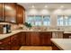 Kitchen detail showing stainless steel sink and stone counters at 402 Westwood Dr, Chapel Hill, NC 27516