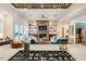 An open-concept room showcasing living with fireplace, and kitchen areas with view from stovetop at 402 Westwood Dr, Chapel Hill, NC 27516