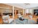 Open living room with hardwood floors, a pool table, and modern furnishings for comfortable living at 402 Westwood Dr, Chapel Hill, NC 27516