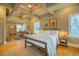 Spacious main bedroom with a coffered ceiling, seating area and hardwood floors at 402 Westwood Dr, Chapel Hill, NC 27516