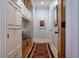 Mudroom with white cabinets, wood bench, and patterned rug at 402 Westwood Dr, Chapel Hill, NC 27516