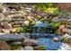 Backyard waterfall featuring rocks and moss at 402 Westwood Dr, Chapel Hill, NC 27516