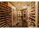 Spacious wine cellar featuring custom wooden racks and tile flooring, perfect for storing your collection at 402 Westwood Dr, Chapel Hill, NC 27516