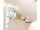 Bright, spacious attic area with comfortable seating, plush carpet, and an open layout perfect for relaxation or hobbies at 415 King George Loop, Cary, NC 27511