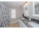 Bathroom featuring a double sink vanity with a granite countertop and tiled floor at 415 King George Loop, Cary, NC 27511