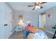 Neutral bedroom with ceiling fan, carpeted floor, and standard closet at 415 King George Loop, Cary, NC 27511