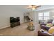 Bonus room with recliners, coffee table, television, and windows providing natural light at 415 King George Loop, Cary, NC 27511