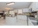 Open-concept kitchen with granite countertops, stainless steel appliances, and ample cabinet space at 415 King George Loop, Cary, NC 27511