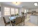 Bright kitchen with granite countertops, stainless steel appliances, and an adjacent dining area at 415 King George Loop, Cary, NC 27511