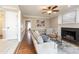 Spacious living room with a fireplace, hardwood floors, and neutral decor at 415 King George Loop, Cary, NC 27511