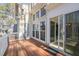 View of deck and house exterior, showing sliding glass door and multiple windows at 42 Renwick Ct, Raleigh, NC 27615
