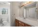 Neutral bathroom with double sink vanity and framed mirror at 42 Renwick Ct, Raleigh, NC 27615