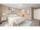 Comfortable bedroom with neutral tones, natural light, and a ceiling fan at 42 Renwick Ct, Raleigh, NC 27615