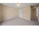 Neutral bedroom features carpet, a ceiling fan, and white closet doors at 42 Renwick Ct, Raleigh, NC 27615