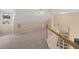 Carpeted bonus room with a ceiling fan and a window allowing lots of natural light at 42 Renwick Ct, Raleigh, NC 27615