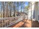 Spacious wooden deck surrounded by tall, mature trees, perfect for relaxing outdoors at 42 Renwick Ct, Raleigh, NC 27615